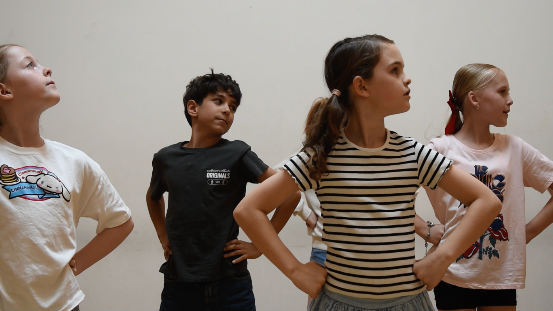 Students practicing character work in an in-schools workshop