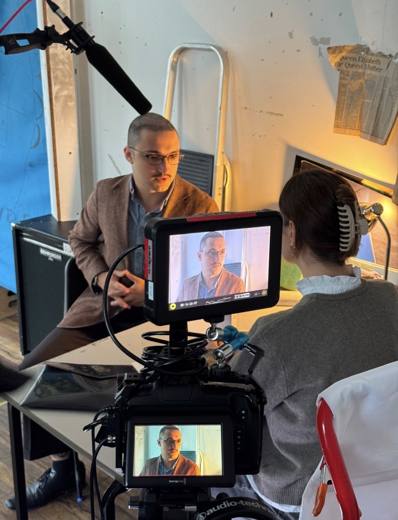 A ReAct tutor being filmed during an on-camera interview