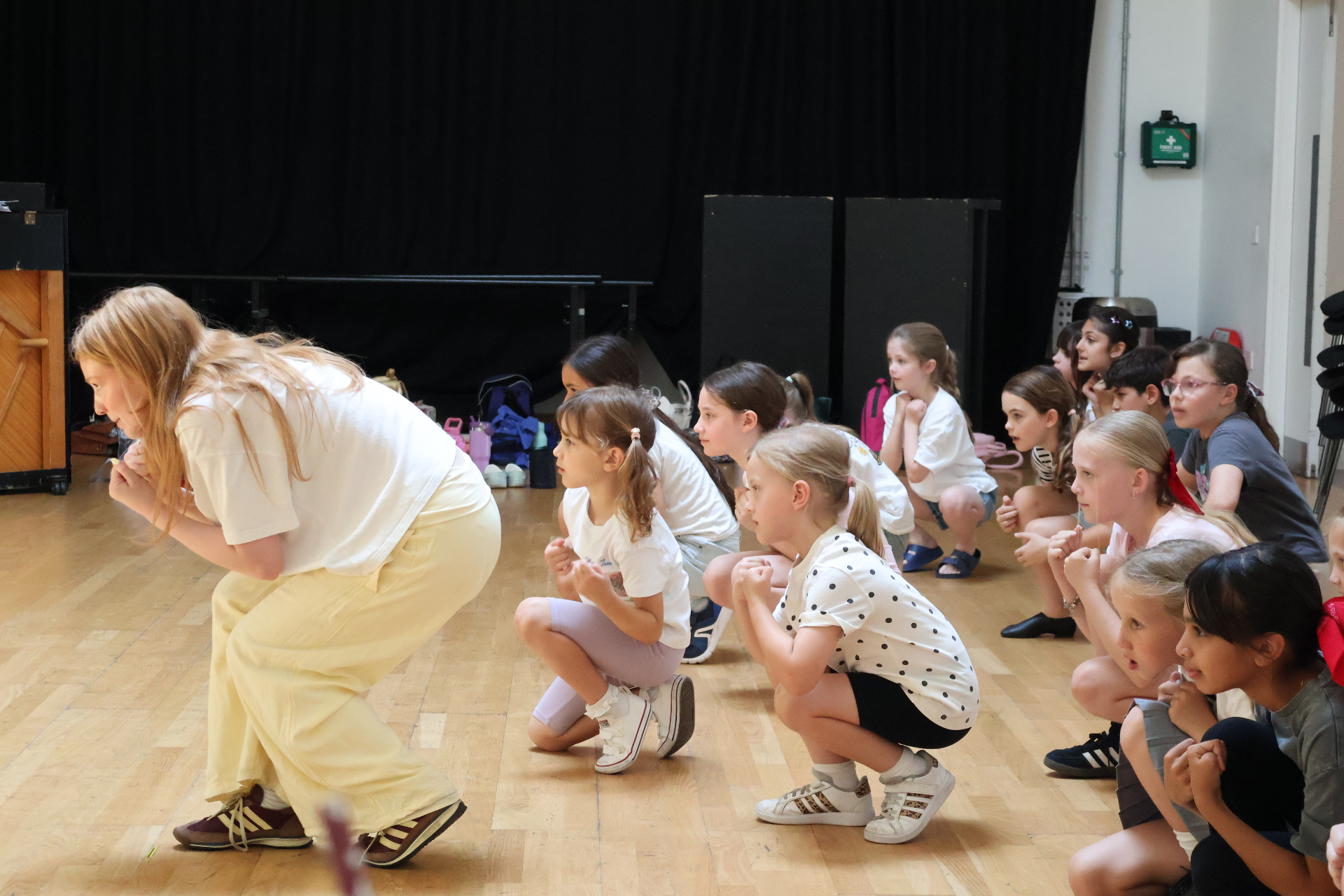 ReAct tutor leading a workshop with children