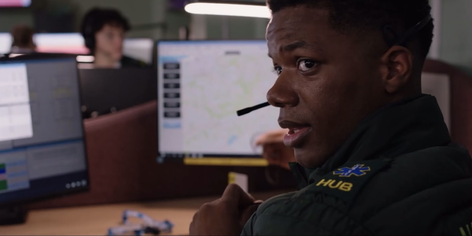 A ReAct tutor in a film scene at a control room desk